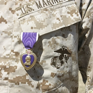 The Purple Heart award hangs over the heart of a U. S. Marine