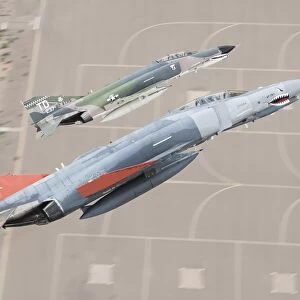 Two QF-4E Phantom II drones break over Holloman Air Force Base, New Mexico