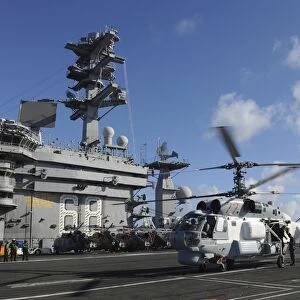 A Russian Navy KA-27 Helix helicopter lands aboard USS Nimitz