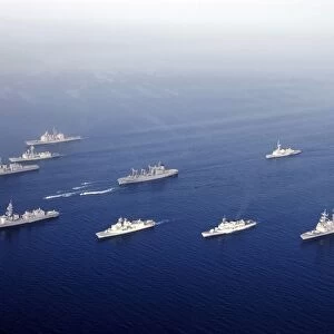 Ships and Rigid Hull Inflatable Boats assemble in formation