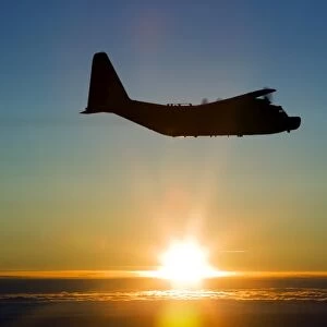 Silhouette of a MC-130H Combat Talon against a setting sun over East Anglia, UK