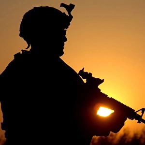 Silhouette of a U. S. Army Soldier providing perimeter security