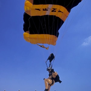 A skydiver from the U. S. Army Golden Knights touches down onto the dropzone target