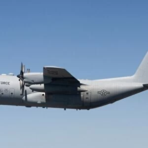 A specially modified C-130 Hercules in flight