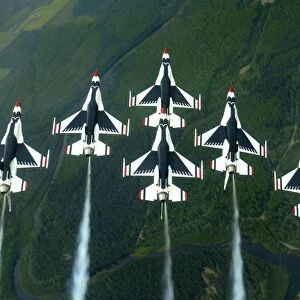 The Thunderbird aerial demonstration team performs a loop while in the Delta formation