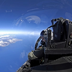 U. S. Air Force captain looks out over the sky in a F-15 Eagle