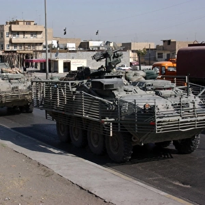 U. S. Army soldiers patrolling in Stryker armored wheeled vehicles as part of Operation