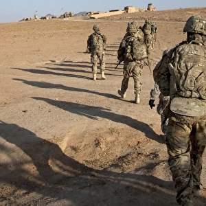 U. S. Army soldiers walk toward a checkpoint in Afghanistan