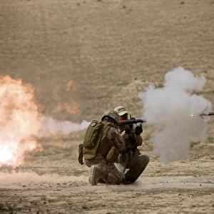 A U. S. Contractor fires a rocket-propelled grenade launcher
