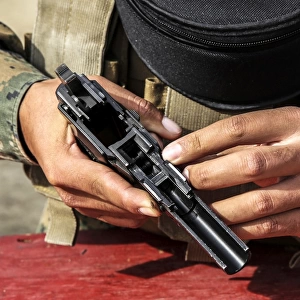U. S. Marine assembles the M9 pistol