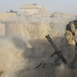 A U. S. Marine fires a mortar round during combat operations in Afghanistan