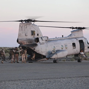 U. S. Marines board a CH-46 Sea Knight helicopter