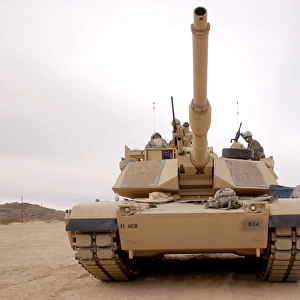 U. S. soldiers perform maintenance on their M1 Abrams tank