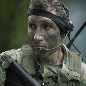 U. S. Special Forces soldier equipped with a communications headset during combat