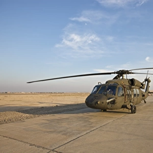 A UH-60 Black Hawk parked at a military base in Tikrit, Iraq