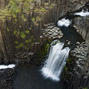 Litlanesfoss waterfall, Hengifoss river, Basalt lava solidified in hexagonal columns