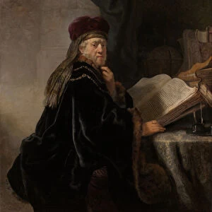 A Scholar Seated at a Desk (Scholar at his Study). Artist: Rembrandt van Rhijn (1606-1669)