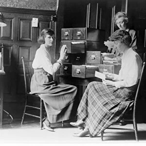 Three women work at the card index files at the headquarters of the National Womans Party, c