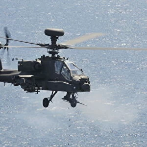 Army Apache Helicopter Fires 30mm Cannon During Exercise from HMS Ocean