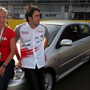 Formula One World Championship: Jutta Kleinschmidt and Ricardo Zonta Toyota Test Driver prepare for the taxi rides of the circuit