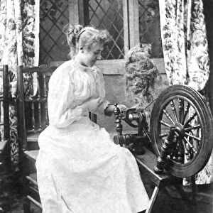 Spinster with spinning wheel