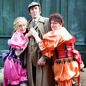 Comedian Russ Abbott dressed as Sherlock Holmes flanked by Sherrie Hewson (left
