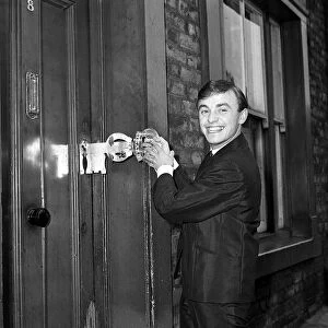 Gerry Marsden opens the door to his house on his 21st birthday 1963