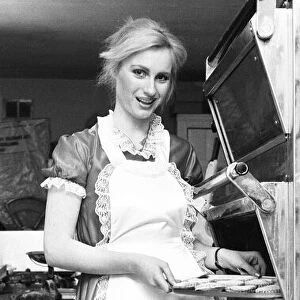 Model Janet Slaven seen here helping putting her mince pies into the oven December 1982