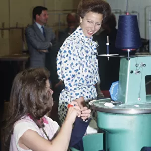 Princess Anne visit to East Kilbride Scotland talking to younh woman at knitting machine