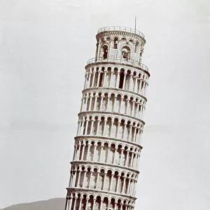 Frontal view of the so-called leaning Tower of the Cathedral of Pisa. In the background the city walls can be glimpsed and the silhouette of the hills around Pisa