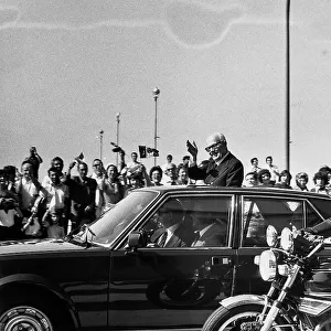 The President of the Republic, Sandro Pertini, as he greets the public from the presidential vehicle, during an official visit