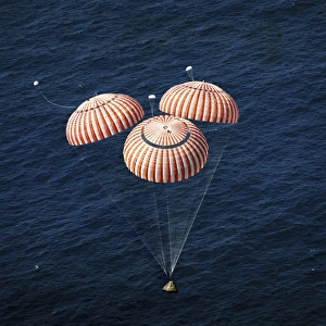 The Apollo 16 Command Module approaching touchdown in the central Pacific Ocean