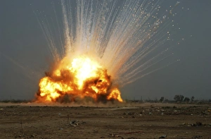 A cache of unexploded ordnance is detonated