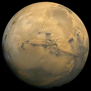 <b class=qtipBold><figcaption>Global mosaic of Mars</figcaption></b><br>Global mosaic of Mars. Visible in the center of this mosaic is the largest known chasm in the solar system, Valles Marineris.<br><em>© Stocktrek Images</em> Global mosaic of Mars