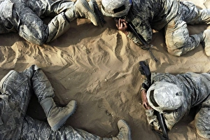 High angle view of Basic trainees crawling through a tactical course