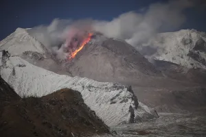 Moonlit view of glowing lava down flank of Shiveluch Volcano Moonlit view of glowing lava down flank of Shiveluch Volcano