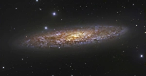 <b class=qtipBold><figcaption>The Sculptor Galaxy</figcaption></b><br>The Sculptor Galaxy, NGC 253, is a prototypical starburst galaxy. The central 10, 000 light years of this galaxy shows evidence of a violent burst of star formation that began some 30 million ago.<br><em>© Robert Gendler/Stocktrek Images</em> The Sculptor Galaxy